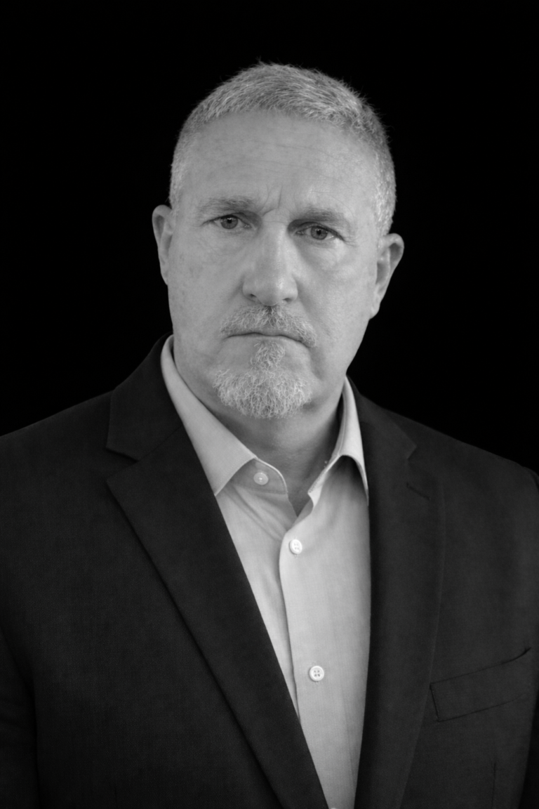 Steve John black and white headshot.